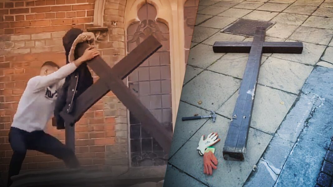 man tears down large Christian cross outside UK church in broad daylight