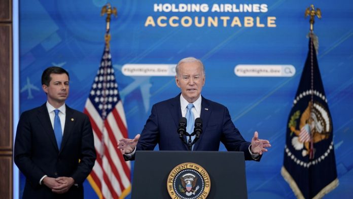 transportation secretary pete buttigieg listens as president joe biden delivers remarks on requiring airlines to compensate passengers for extensive flight delays and cancellations in the south court auditorium on the white house complex, monday, may 8, 2