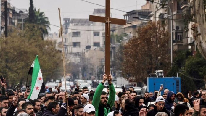 protest against the burning of the christmas tree in hama, in damascus