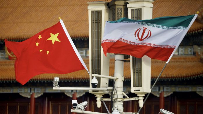 flags of china and iran fly in tiananmen square during iranian president raisi's visit to beijing
