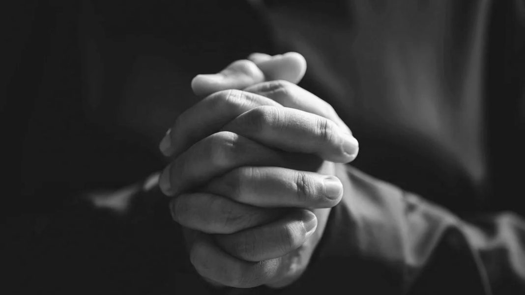 hands folded in prayer praying
