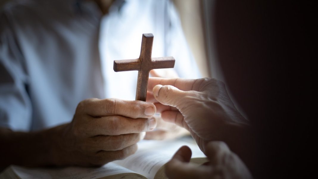christian,hands,of,giving,cross,wood,together,.,christian,good