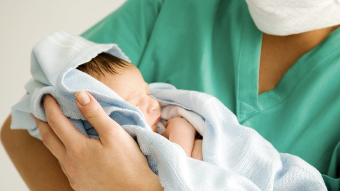 nurse midwife with baby